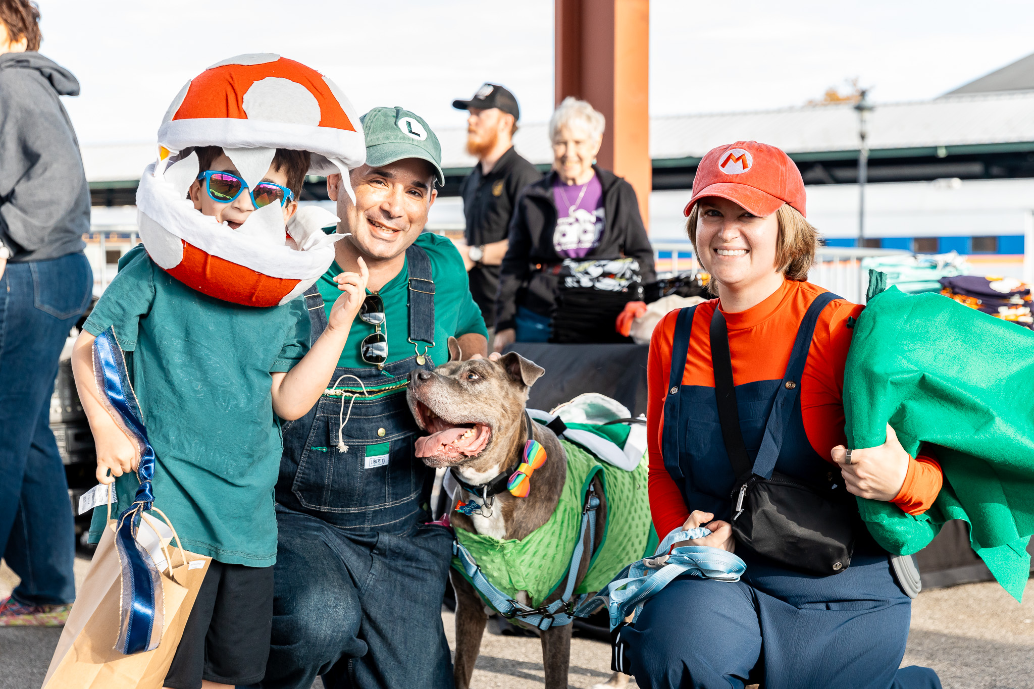 A family and their pup are dressed as characters from Super Mario Bros